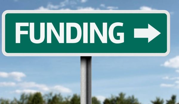 Image of street sign displaying the words Funding